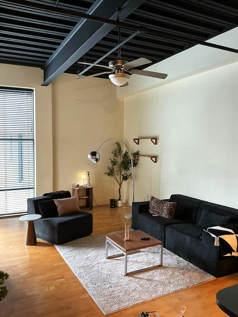 Loft living room with a newly installed ceiling fan